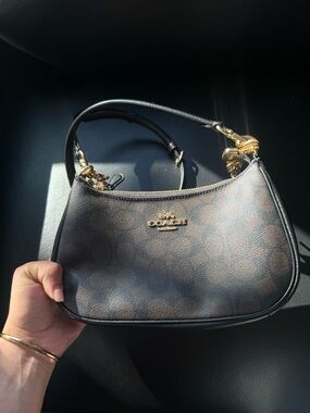 Coach Teri Shoulder Bag with Black Trim and Gold Hardware.